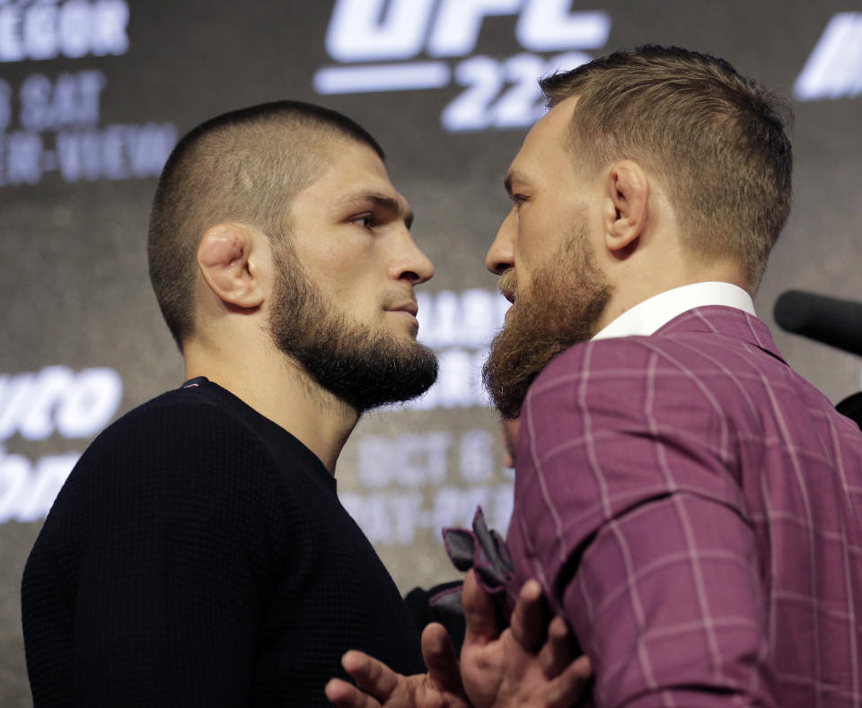 Conor McGregor and Khabib Nurmagomedov pose for pictures during a news conference in New York on Sept. 20, 2018. (AP Photo/Seth Wenig)