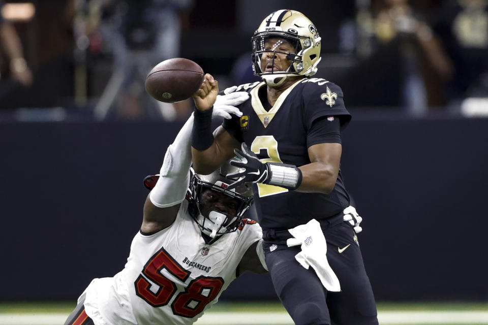 Tampa Bay Buccaneers linebacker Shaquil Barrett strips the ball form New Orleans Saints quarterback Jameis Winston during the first half of an NFL football game in New Orleans, Sunday, Sept. 18, 2022. The Saints recovered the ball. (AP Photo/Butch Dill)