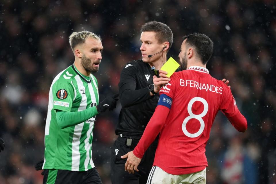 Fernandes was booked for challenge on Betis goalkeeper Claudio Bravo (Getty Images)