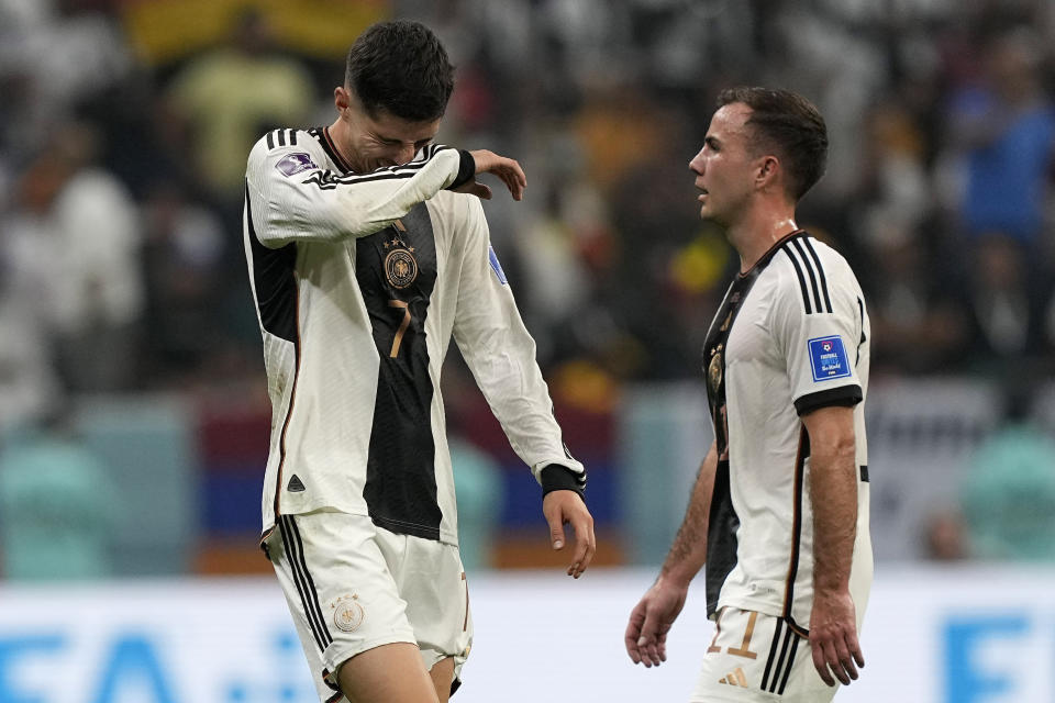 Germany's Kai Havertz, left, and Germany's Mario Goetze react after the World Cup group E soccer match between Costa Rica and Germany at the Al Bayt Stadium in Al Khor , Qatar, Thursday, Dec. 1, 2022. (AP Photo/Martin Meissner)