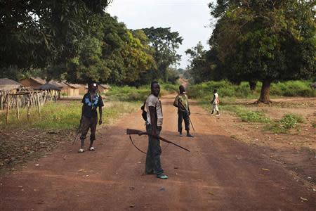 Militia fighters known as anti-balaka stand guard in Mbakate village, Central African Republic November 25, 2013. They say they are protecting their village from Seleka fighters. REUTERS/Joe Penney