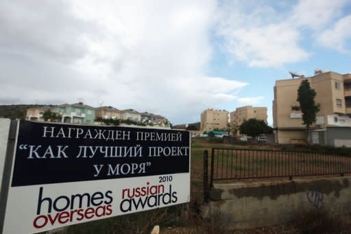 A billboard promoting real estate to Russians in the Cypriot city of Limassol. Russians are preparing to withdraw billions of euros from Cyprus and the island will plunge into a recession lasting for decades due to the onerous terms of a EU bailout, economists warn.