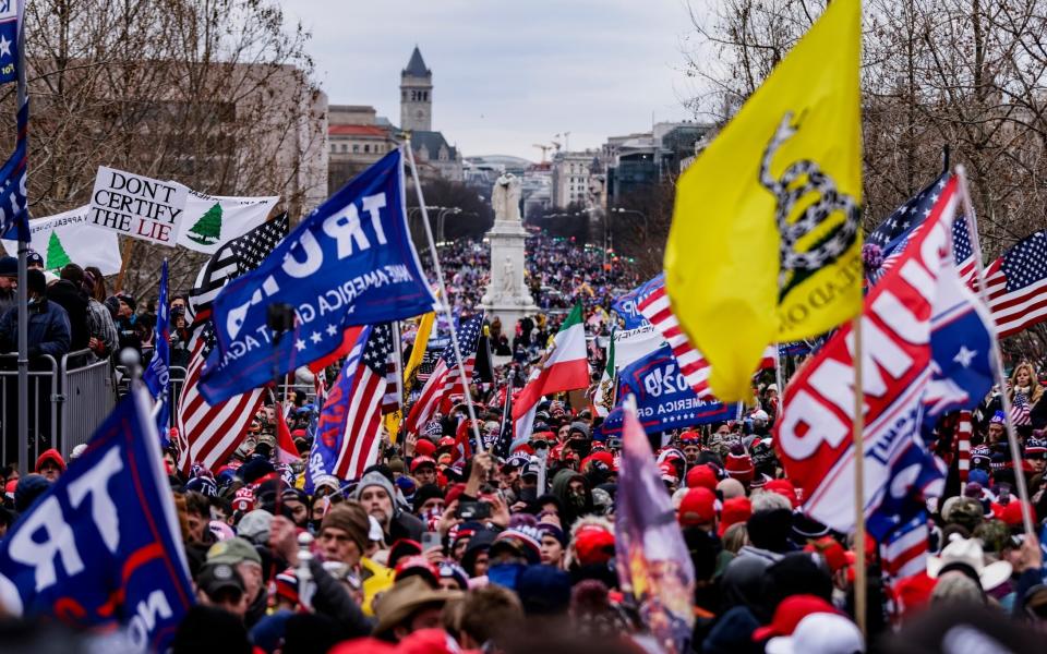 WASHINGTON, DC - JANUARY 06: Pro-Trump supporters gather outside the U.S. Capitol following a rally with President Donald Trump on January 6, 2021 in Washington, DC. Trump supporters gathered in the nation's capital today to protest the ratification of President-elect Joe Biden's Electoral College victory over President Trump in the 2020 election. ( - Samuel Corum/Getty Images