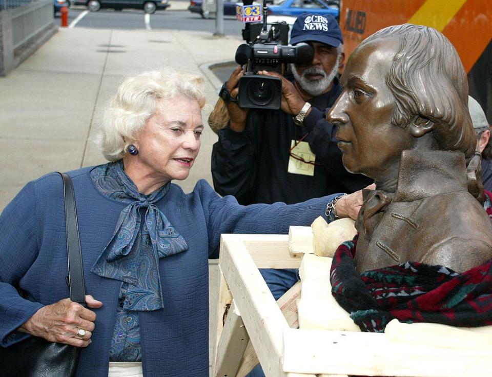 Former Supreme Court Justice Sandra Day O'Connor examines a life-size bronze statue of James Madison, one of the signers of the U.S. Constitution, while on a tour of the National Constitution Center (NCC) Site on May 2, 2002, in Philadelphia, Pennsylvania.