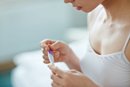 <span class="caption">Lower fertility was linked to poorer health outcomes for both men and women.</span> <span class="attribution"><a class="link " href="https://www.shutterstock.com/image-photo/young-woman-pregnancy-test-hands-427218448" rel="nofollow noopener" target="_blank" data-ylk="slk:Pressmaster/ Shutterstock;elm:context_link;itc:0;sec:content-canvas">Pressmaster/ Shutterstock</a></span>