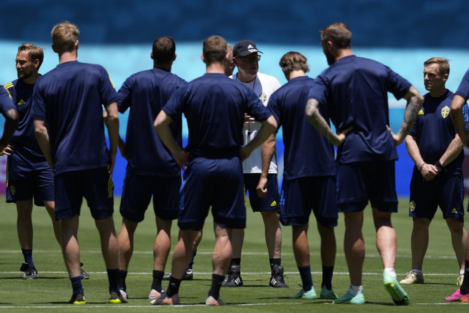 Sweden's manager Janne Andersson, center, speaks to his players during a training session at the La Cartuja stadium in Seville, Spain, Sunday, June 13, 2021. Sweden will play against Spain on Monday for the Group E of the Euro 2020 soccer championship. (AP Photo/Thanassis Stavrakis)