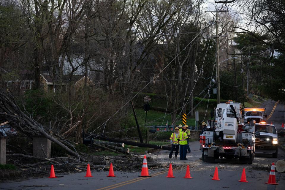 NES workers repair power lines along Wilson Blvd. near West End Ave. after severe weather and strong winds blew through Nashville, Tenn. Friday, March 3, 2023.