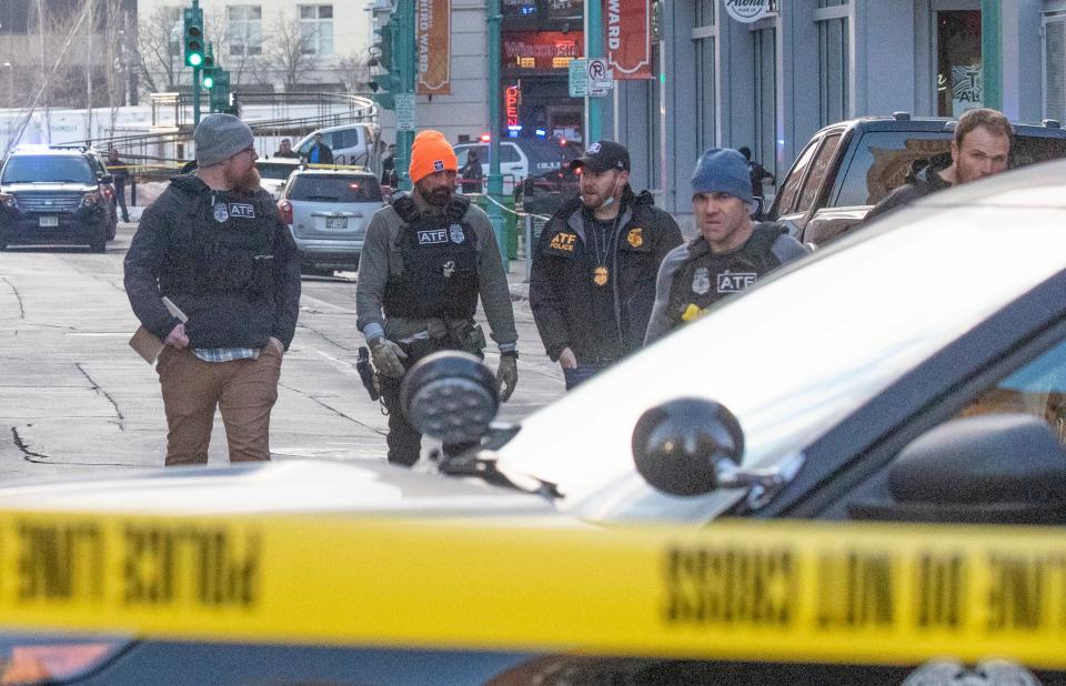 Police work on the scene of an officer involved shooting near the intersection of North Water Street and East Buffalo Street in Milwaukee on Thursday.