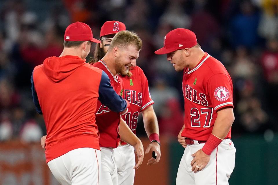 Los Angeles Angels starting pitcher Reid Detmers, a 2017 Glenwood High School graduate, celebrates with Mike Trout (27) after throwing a no-hitter against the Tampa Bay Rays in a baseball game in Anaheim, Calif., Tuesday, May 10, 2022. The Angels won 12-0.
