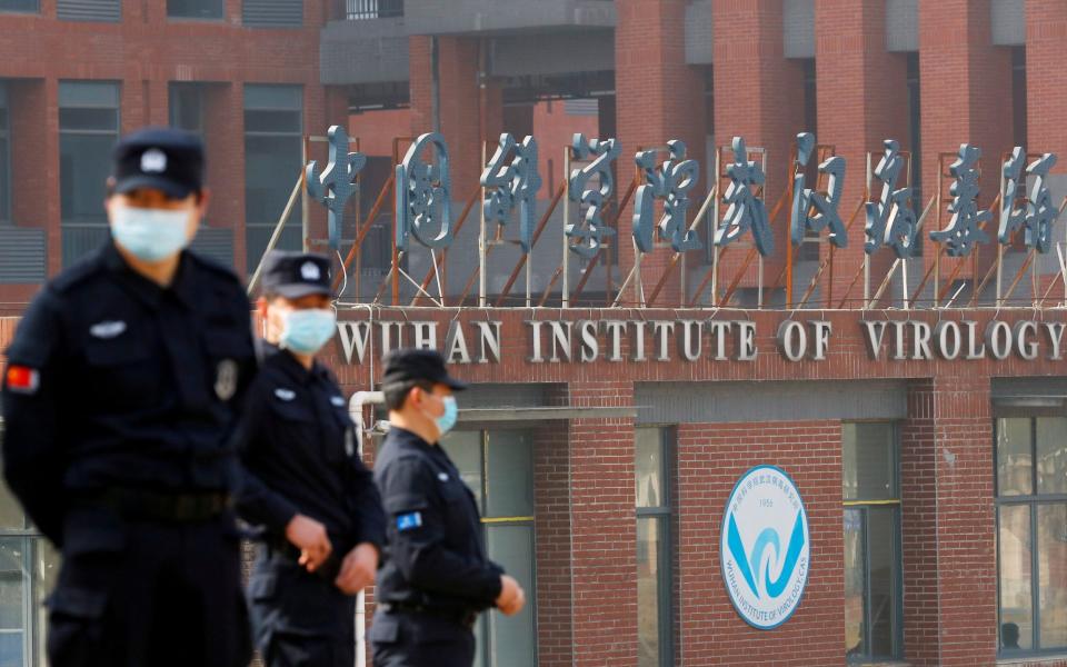 Security personnel outside the Wuhan Institute of Virology, the lab at the centre of the Covid lab leak theory - REUTERS