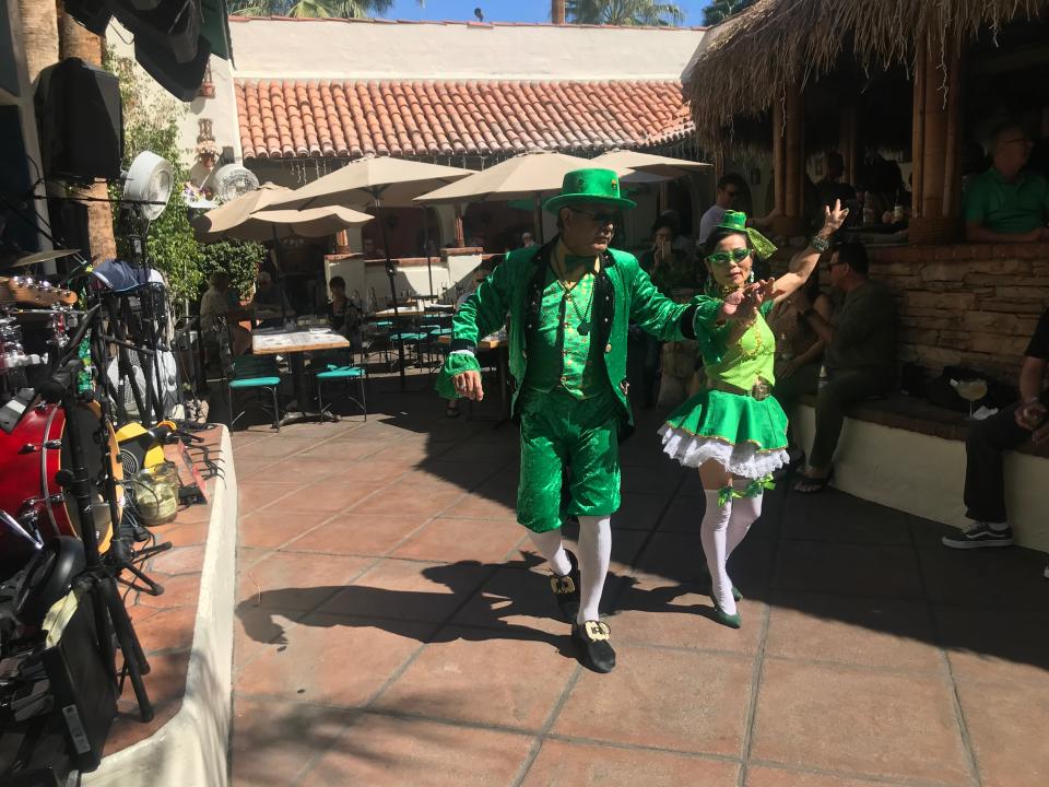 A couple dances at Las Casuelas Terraza in downtown Palm Springs on St. Patrick's Day on Sunday, March, 17, 2019.