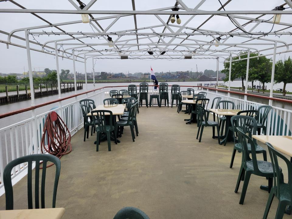 The top deck of the Holland Princess is usually covered, but the canopy is currently being replaced. The boat offers lunch and dinner cruises along Lake Macatawa.