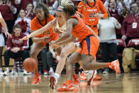 Indiana guard Sydney Parrish, center, goes after a loose ball between Illinois defenders Adalia McKenzie, left, and Makira Cook in the second half of an NCAA college basketball game in Bloomington, Ind., Sunday, Dec. 4, 2022. Indiana won 65-61. (AP Photo/AJ Mast)