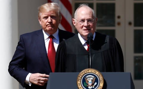 President Donald Trump, left, and Supreme Court Justice Anthony Kennedy participate in a public swearing-in ceremony for Justice Neil Gorsuch - Credit: AP