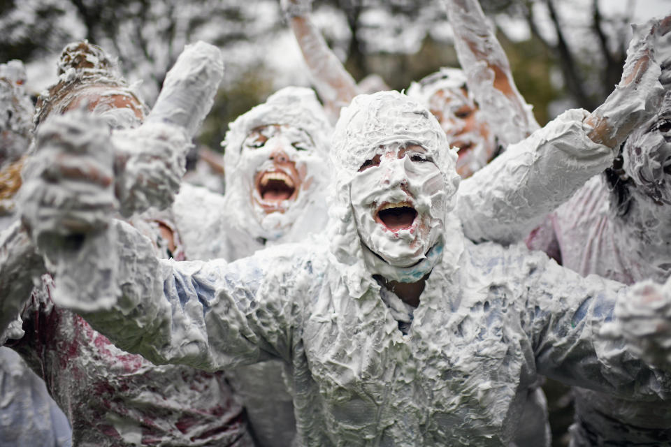 <p>Students from St Andrews University indulge in a tradition of covering themselves with foam to honor the “academic family” on Lower College Lawn on Oct. 23, 2017, in St Andrews, Scotland. (Photo: Jeff J Mitchell/Getty Images) </p>