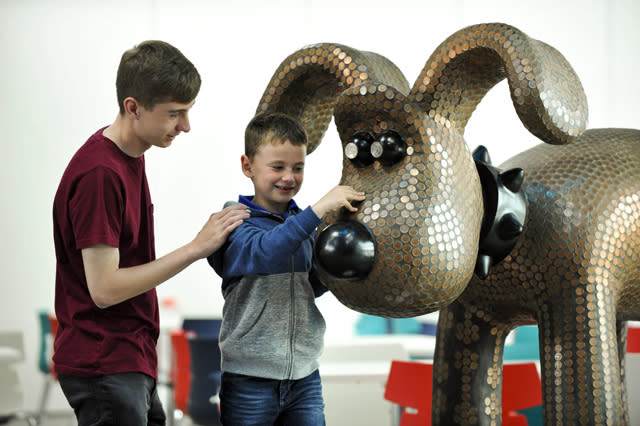 EDITORIAL USE ONLY Cameron Williams (left) and Rory Whyte during a visit to The Royal Mint Experience, which opens to the public today at The Royal Mint in South Wales. PRESS ASSOCIATION Photo. Issue date: Tuesday May 17, 2016. The Royal Mint Experience will give visitors first-hand knowledge of the manufacturing journey, while a series of static and interactive exhibitions consisting of six zones will bring the 1,000-year-old organisationï¿½s rich heritage to life. Photo credit should read: Alistair Heap/PA Wire