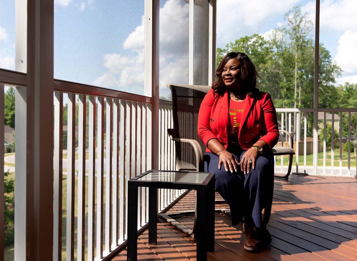 Tammie Harris is photographed on the deck of her home in Durham, N.C. on Tuesday, May 9, 2023. Harris, a real estate broker, recently moved into her seventh home. “I have a passion and an empathy for people who need houses,” said Harris. “Not just a place that they can lay their head, but something that they can leave for legacy and generational wealth.”