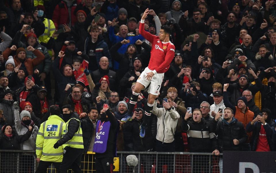 Manchester United's Portuguese striker Cristiano Ronaldo celebrates after scoring their third goal from the penalty spot during the English Premier League football match between Manchester United and Arsenal - AFP