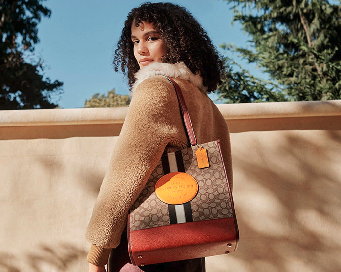 We've got an exclusive code to save you $10 on your next Coach Outlet order. Image via Coach Outlet.