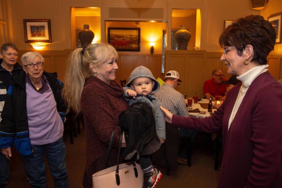 Co-owner Patti Palamidessi, right, greets incoming customers Dianna Nugent, who holds her grand nephew, Ben Jeffery, at Club Pheasant 2019. Palamidessi said one of the secrets to the restuarant’s 83-year run is to make everyone feel like family.
