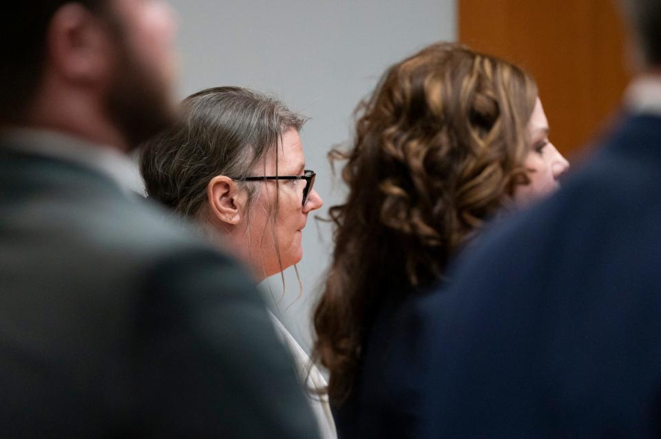 Jennifer Crumbley stands as the jury is seated in the Oakland County courtroom before guilty verdicts were read on four counts of involuntary manslaughter on Feb. 6, 2024.