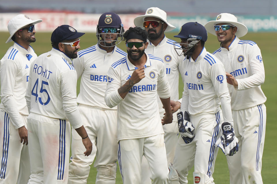 India's Ravindra Jadeja, center, celebrates the wicket of England's Jonny Bairstow on the third day of the first cricket test match between England and India in Hyderabad, India, Saturday, Jan. 27, 2024. (AP Photo/Mahesh Kumar A.)