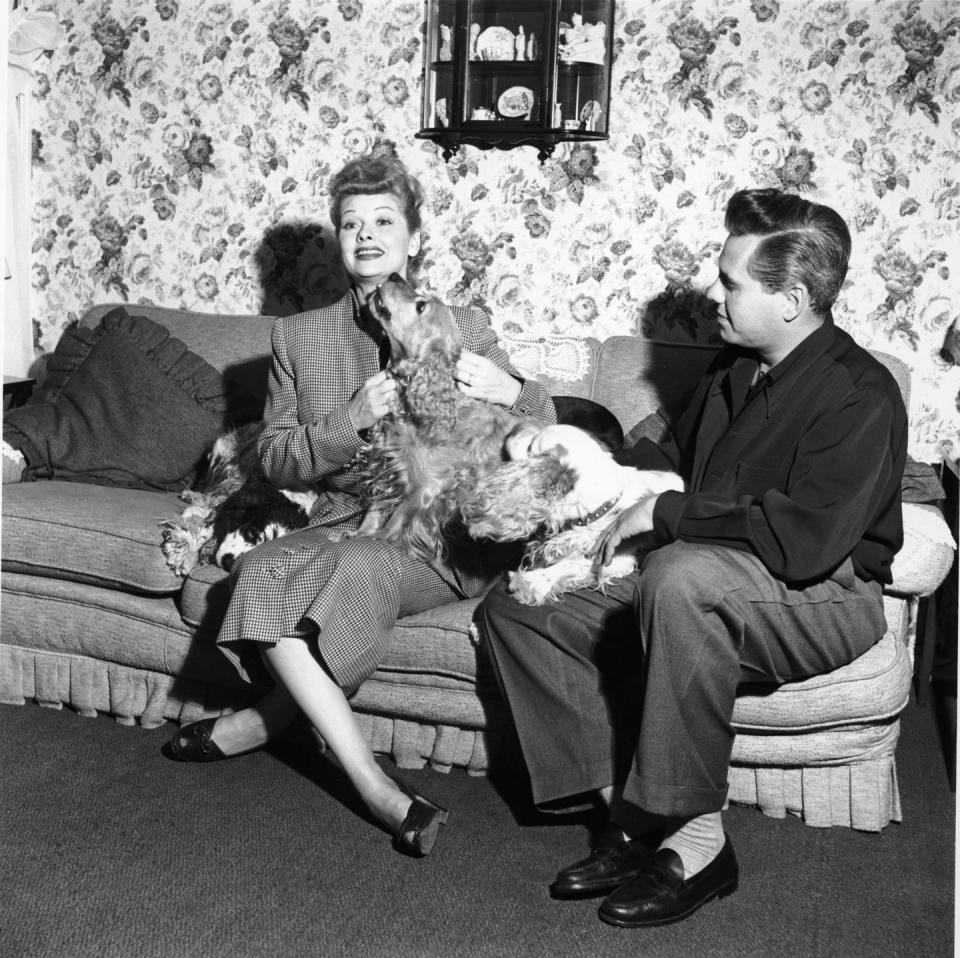 1950: At home with her husband Desi and their three cute cocker spaniels