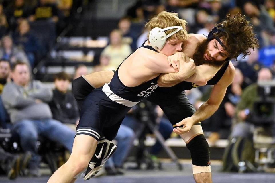 Penn State’s Braeden Davis battles with Michigan’s Michael DeAugustino in their 125 pound match of the Nittany Lions’ 27-9 win on Jan. 19 in Ann Arbor, Mich. Davis upset No. 5 DeAugustino, 5-1. Jennie Tate/For the CDT