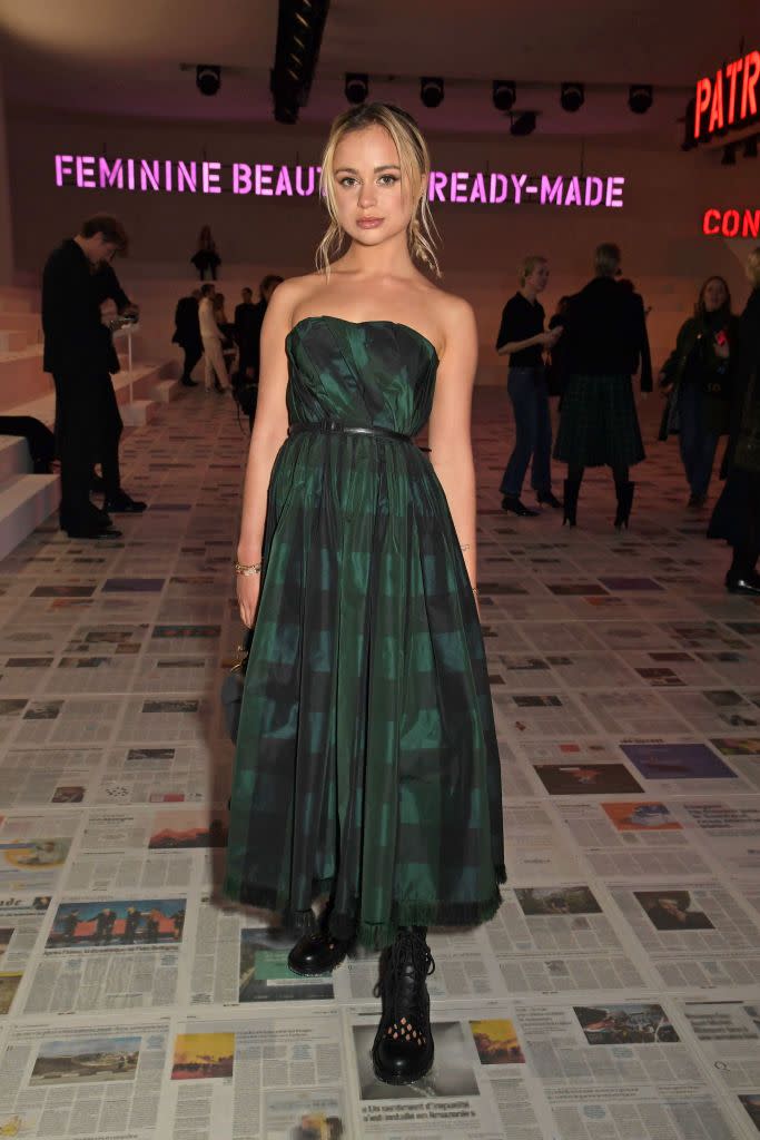 <p>Amelia Windsor dressed in a strapless checked dress and chunky boots. </p>