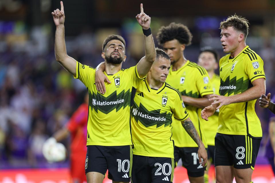 Columbus Crew players celebrate after scoring against Orlando City during an MLS game on May 25, 2024.