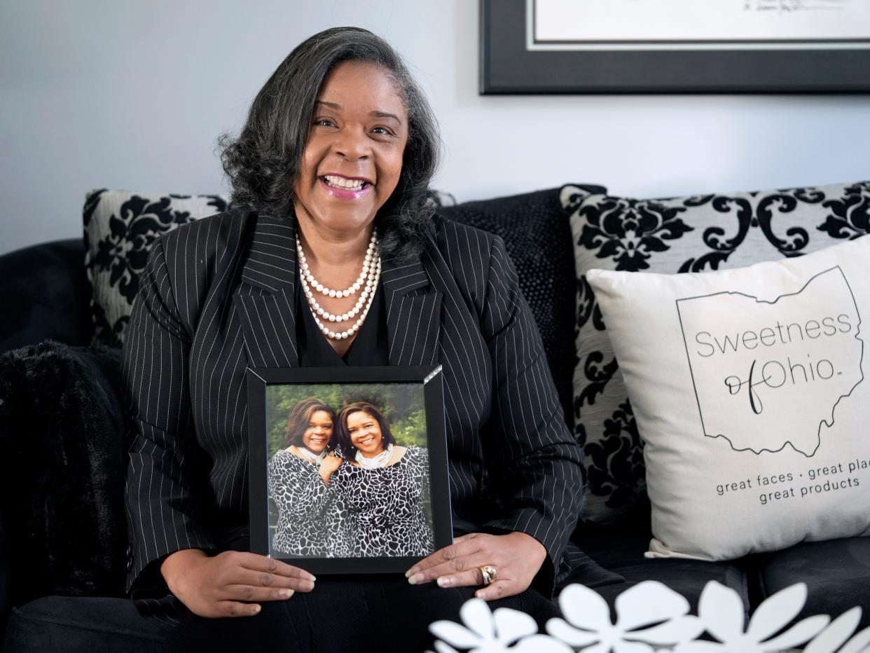 Carolyn Williams Francis holds a photo of her and her sister Carla Bailey who passed away last year from breast cancer and had heart issues. In 2012, Francis went to the hospital after feeling shortness of breath while exercising and prevented her own heart attack. A Boston Univeristy study found that racism may be a stronger predictor of poor health than Black women's individual choices or genetics.