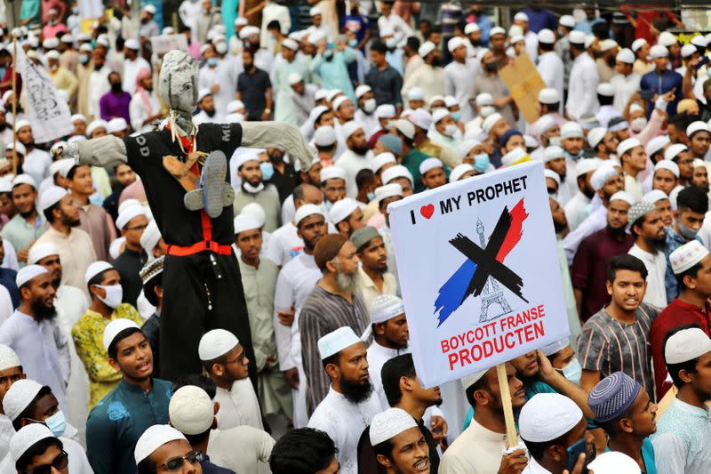 Muslims take part in a protest in Dhaka