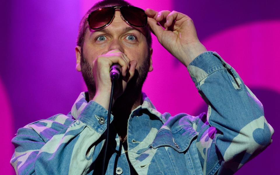 Tom Meighan on stage -  Jonathan Short/Invision/AP