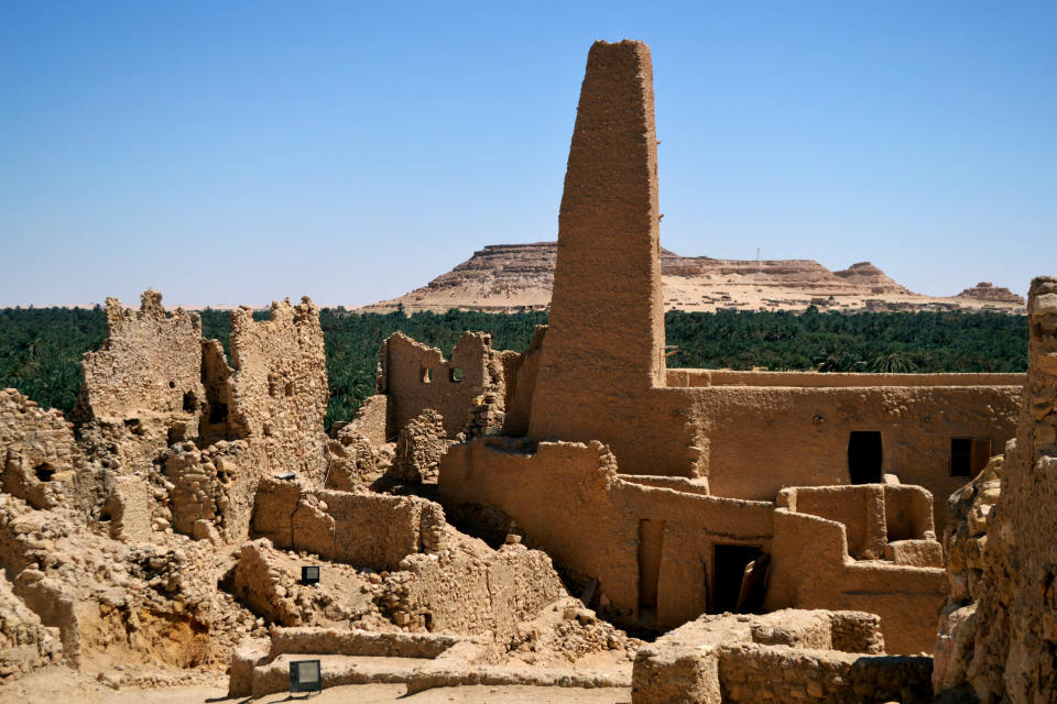 This September 2012 photo shows ruins called the Fortress of Shali in the Egyptian oasis of Siwa, a Berber town of some 27,000 people roughly 450 miles (about 725 kilometers) southwest of Cairo. The palm tree-lined area is known for its quiet charm, ancient ruins, abundant natural springs, a vast salt lake and rolling sand dunes in the surrounding desert. (AP Photo/Kim Gamel)