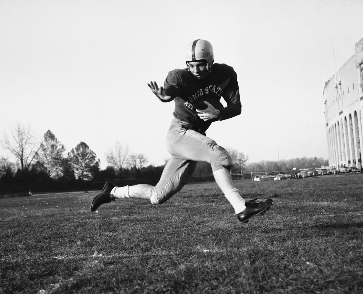 FILE - This is a 1953 file photo showing Ohio State halfback Howard "Hopalong" Cassady. In the history of college football, only 44 schools have been able to make the claim “We’re No. 1” and have The Associated Press poll back up the boast. Ohio State has the most No. 1 rankings. (AP Photo/Harold Valentine, File)