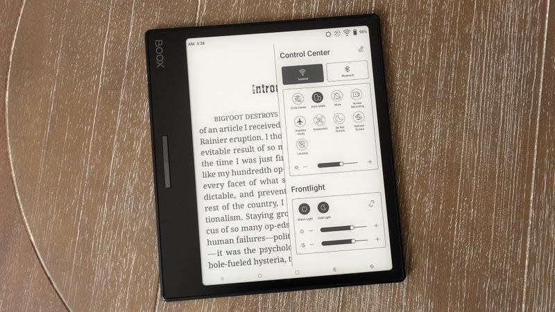 The Onyx Boox Leaf 2 e-reader on a wooden table with the Control Center menu open on-screen.