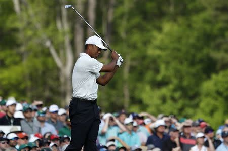 Tiger Woods of the U.S. reacts after hitting off the 12th tee during second round play of the 2018 Masters golf tournament at the Augusta National Golf Club in Augusta, Georgia, U.S., April 6, 2018. REUTERS/Jonathan Ernst