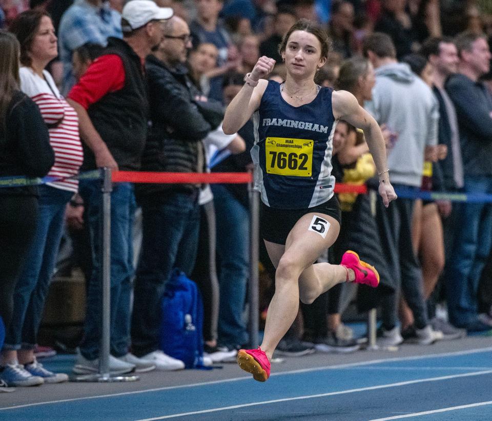 BOSTON - Framingham’s Abby Desmarais wins the 300 meter race during the indoor track and field championship Saturday at the Reggie Lewis Center.