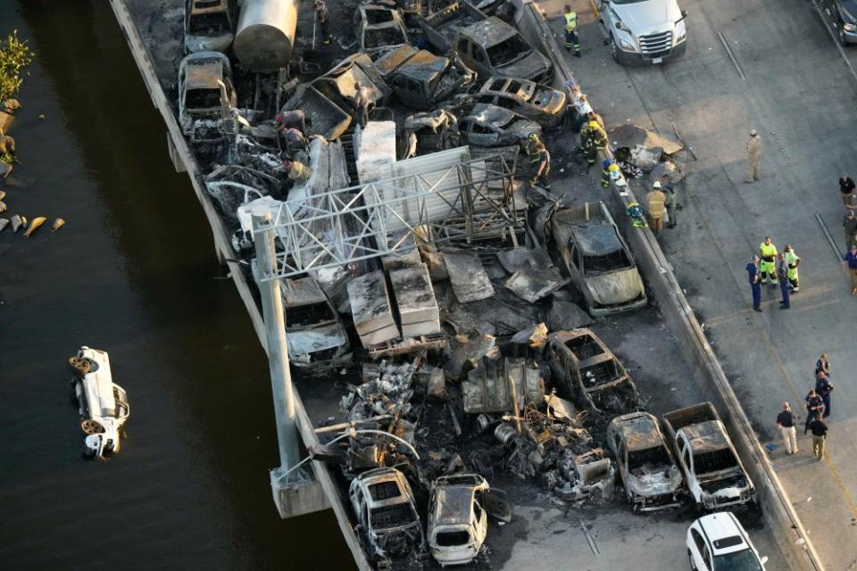 Responders near wreckage in the aftermath of a multi-vehicle pileup caused by "superfog" on I-55 in Manchac, La., Oct. 23.<span class="copyright">Gerald Herbert—AP</span>