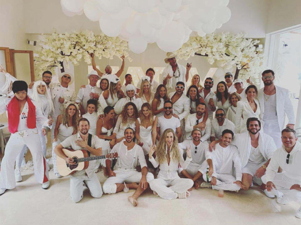 A group of people all wearing white pose for a photo at a party. Photo: Instagram/jasonsmith84.