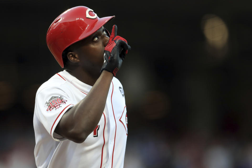 Cincinnati Reds' Aristides Aquino celebrates after hitting a solo home run, his second home run of the game, in the third inning of a baseball game against the Chicago Cubs, Saturday, Aug. 10, 2019, in Cincinnati. (AP Photo/Aaron Doster)