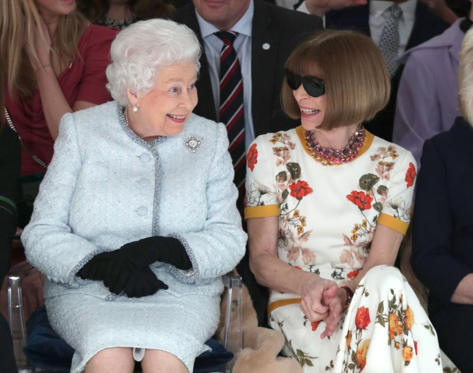 Queen Elizabeth II sits next to Anna Wintour as they view Richard Quinn's runway show, 2018 (Getty Images)