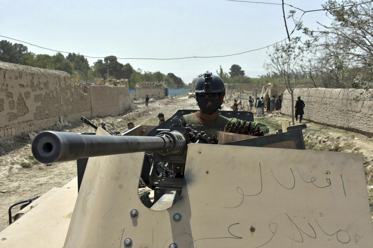 Afghan Security personnel work at the site of a suicide truck bombing in northern Balkh province of Afghanistan, Tuesday, Aug. 25, 2020. Afghan officials said the latest attacks across the country have left at least 12 people dead and scores wounded, including the Taliban truck bombing in the country’s north that targeted a commando base. The violence comes as expectations had been rising that negotiations could soon get underway between the Afghan government and the insurgents. (AP Photo)