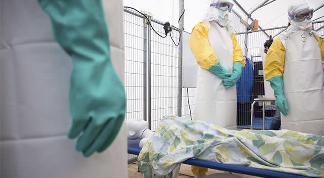 uring a training session participants listen as they stand over a mannequin on a stretcher during a training course to instruct non-governmental organisation (NGO) workers and doctors on how to deal with the Ebola virus in Brussels. Photo: AP