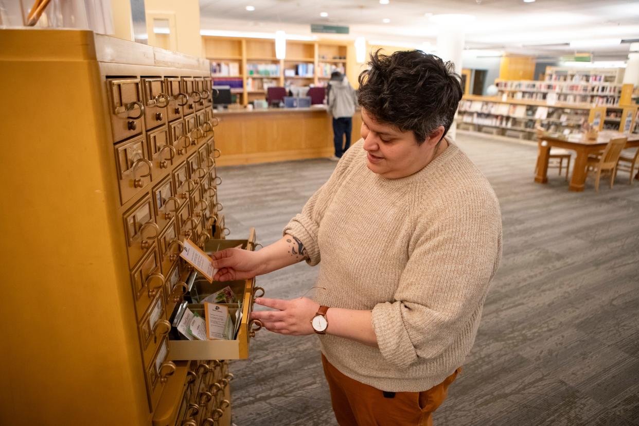 Eugene Public Library director Angela Ocaña looks through the library’s seed library on Wednesday.