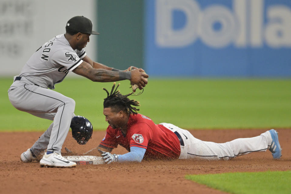 Aug 5, 2023; Cleveland, Ohio, USA; Cleveland Guardians third baseman Jose Ramirez (11) slides into second with an RBI double as Chicago White Sox shortstop Tim Anderson (7) is late with the tag during the sixth inning at Progressive Field. Mandatory Credit: Ken Blaze-USA TODAY Sports