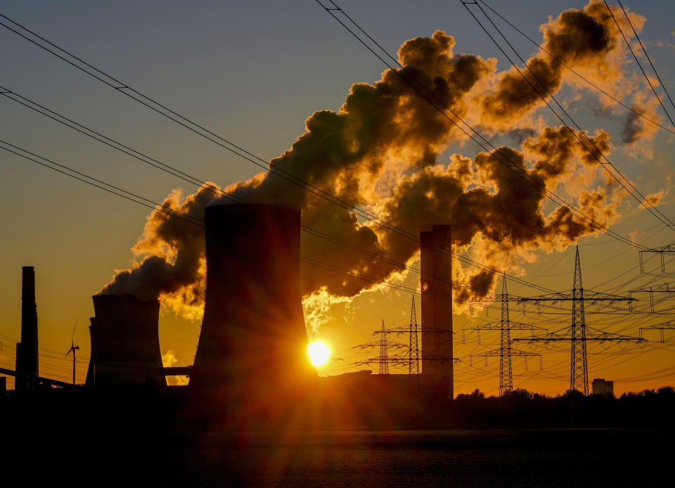 FILE - In this Oct. 24, 2021, file photo, steam comes out of the chimneys of the coal-fired power station in Niederaussem, Germany. (AP Photo/Michael Probst, File)