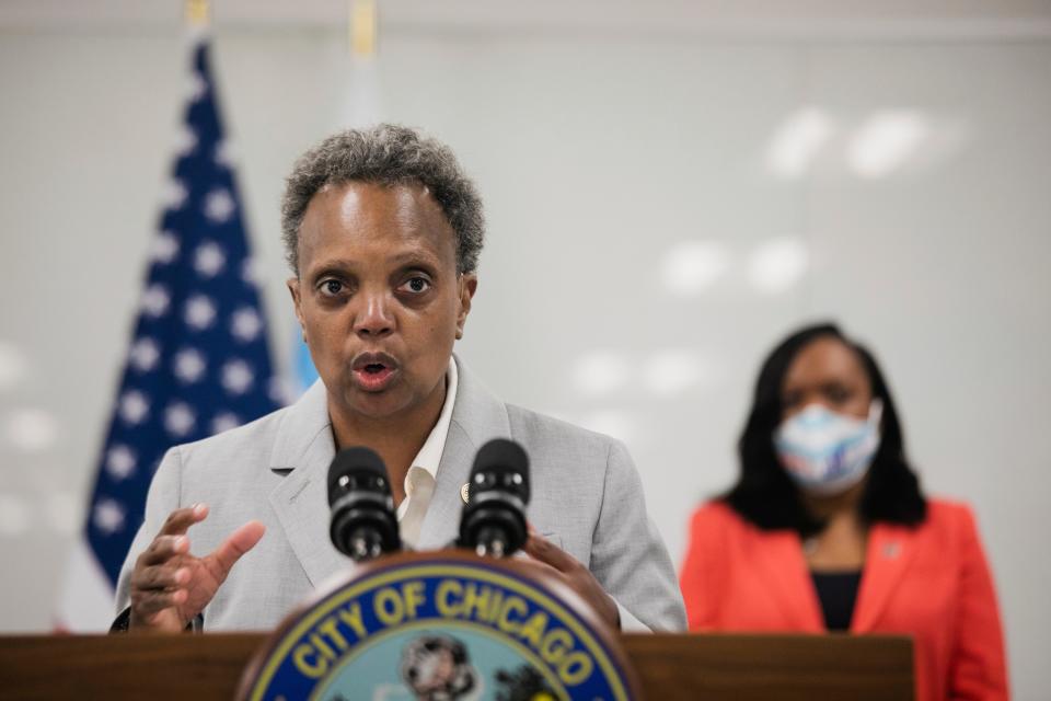 Chicago Mayor Lori Lightfoot, joined by Chicago Public Schools CEO Dr. Janice K. Jackson, right rear, announce a preliminary reopening framework for public schools during a press conference, Friday, July 17, 2020, at CPS Headquarters in Chicago.