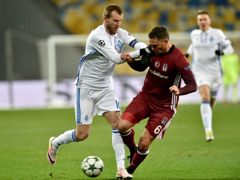 FC Dynamo's forward Andriy Yarmolenko (L) and Besiktas JK's defender Dusko Tosic (R) vie for the ball during the UEFA Champions League football match between FC Dynamo and Besiktas JK at the Olympiyski Stadium in Kiev on December 6, 2016