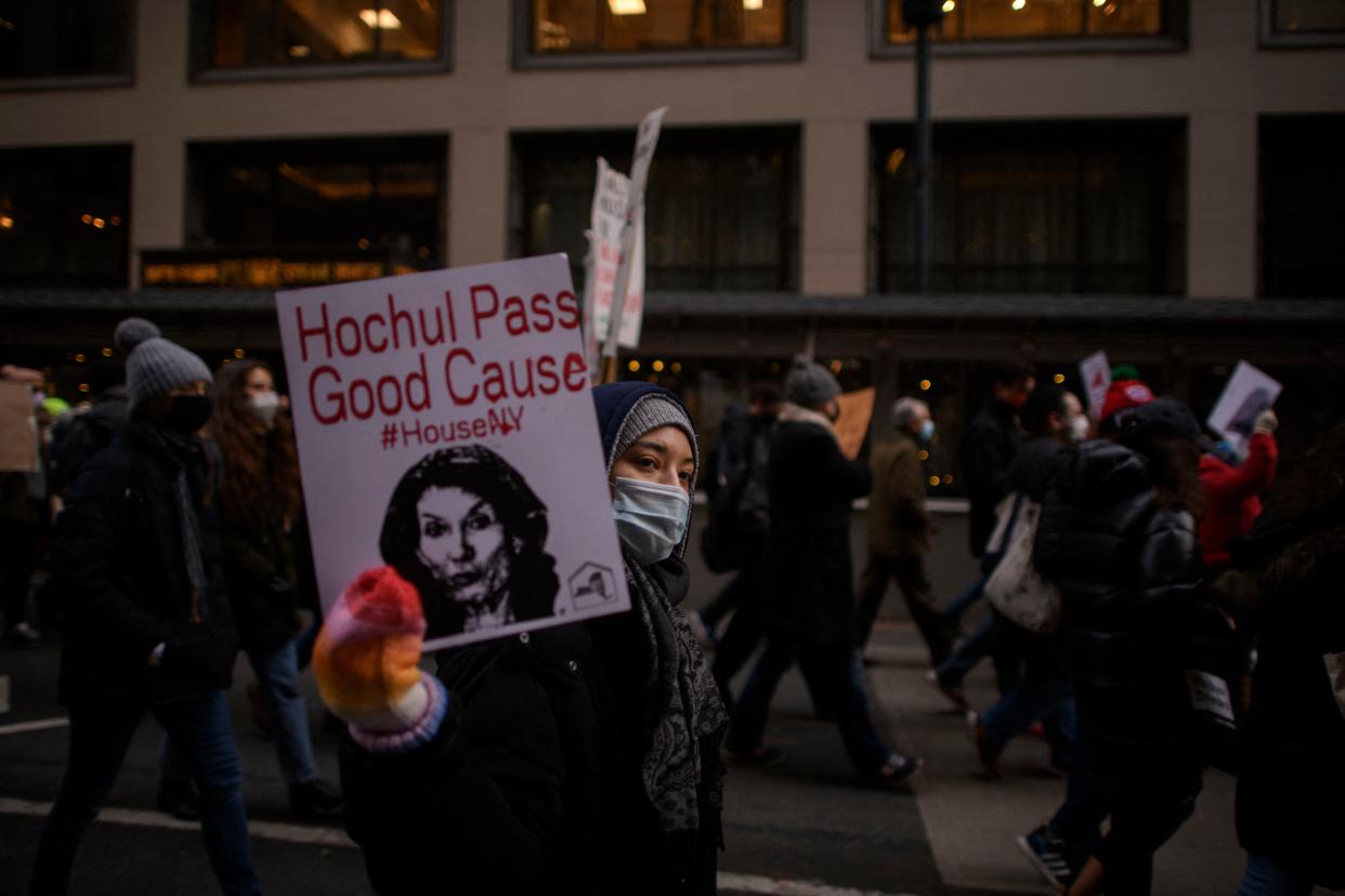 Protesters hold placards and shout slogans during a march calling for an extension to the eviction moratorium on January 14, 2022 in New York, New York.